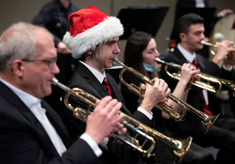 Members of the W&amp;J wind ensemble are led by Clint Bleil during a rehearsal December 6, 2021 before the holiday concert in the Olin Theatre on the campus of Washington &amp; Jefferson College in Washington, Pa.